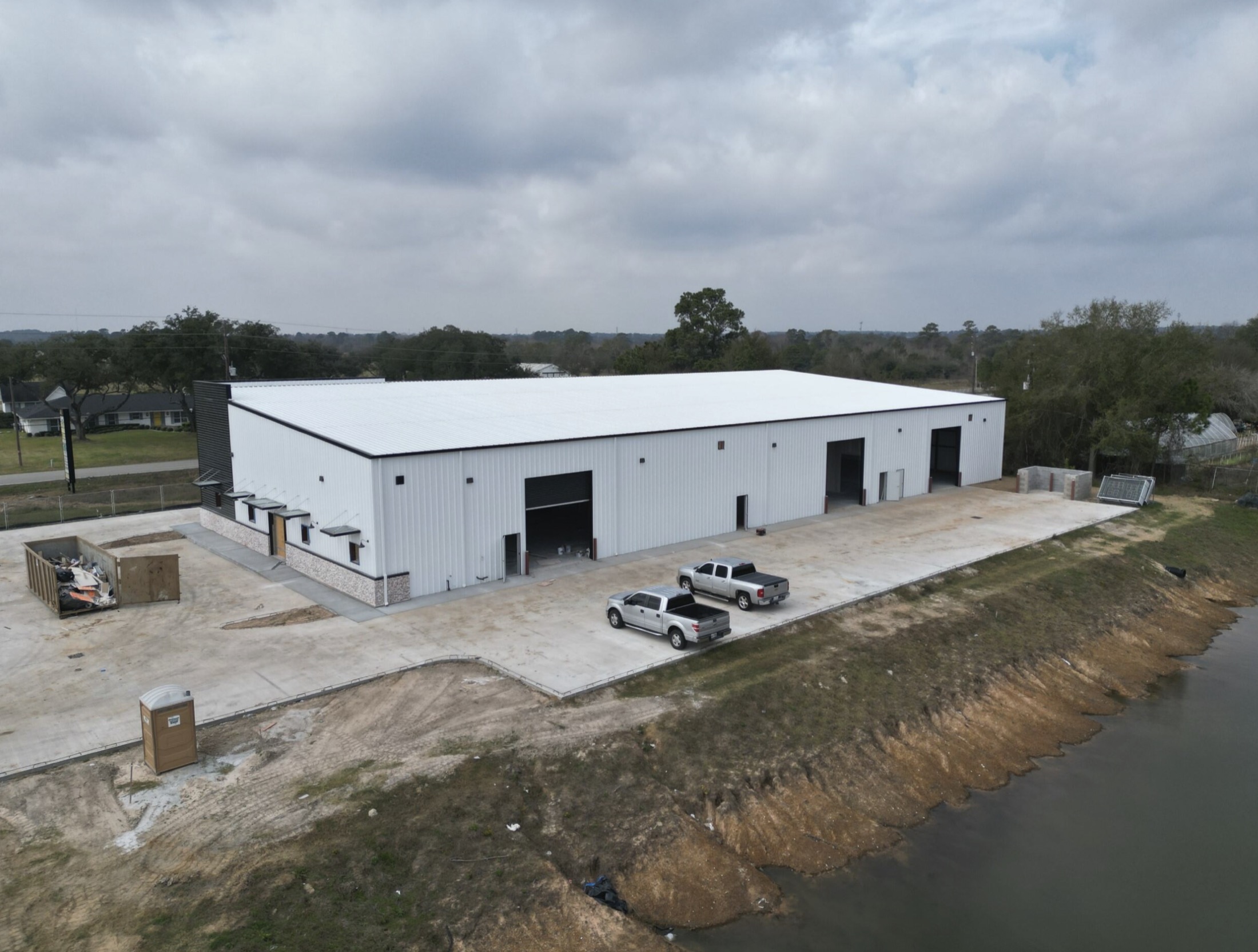 Aerial view of completed white commercial metal building