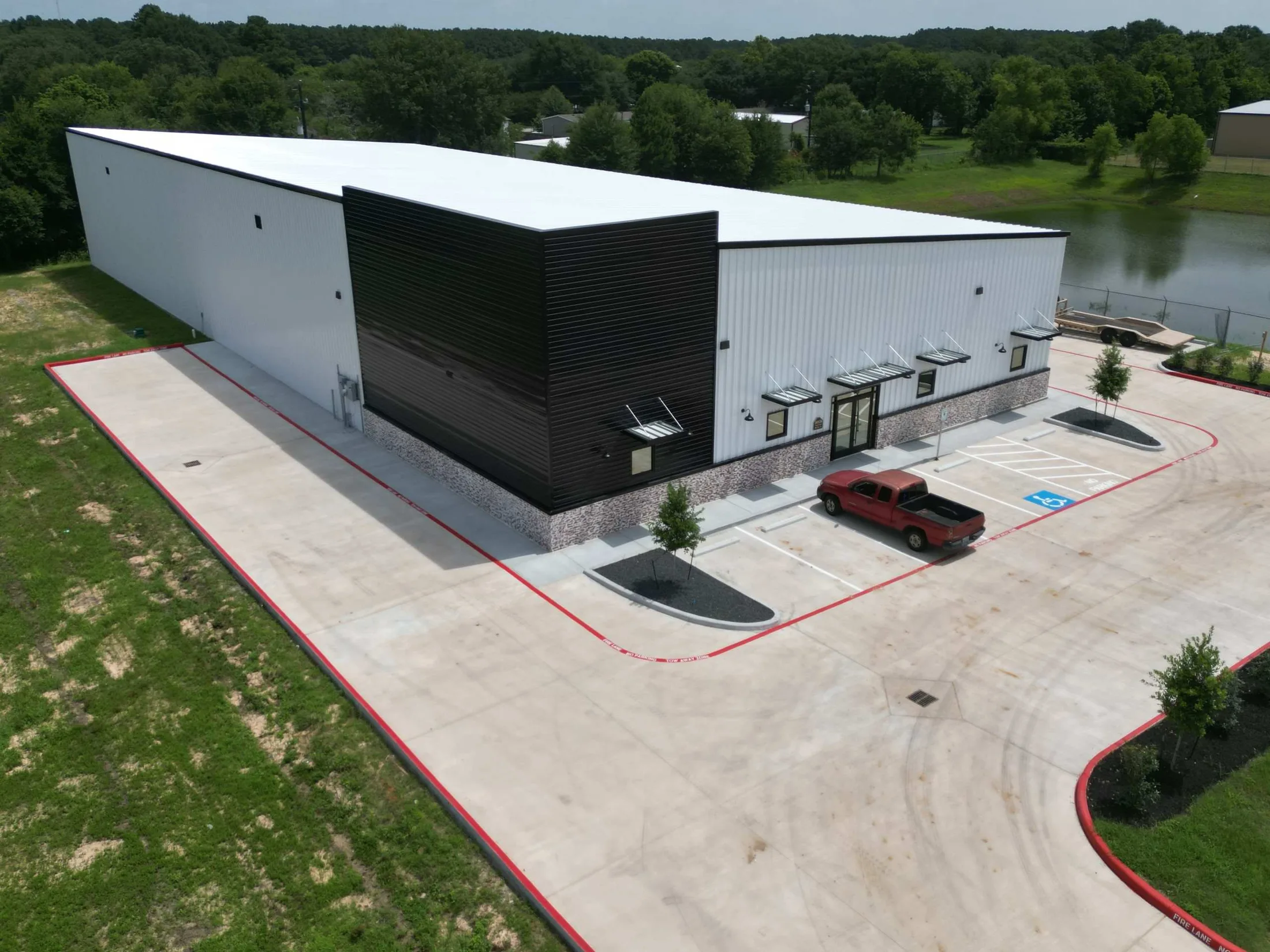 Completed Cheeky Plum commercial building with black and white metal exterior