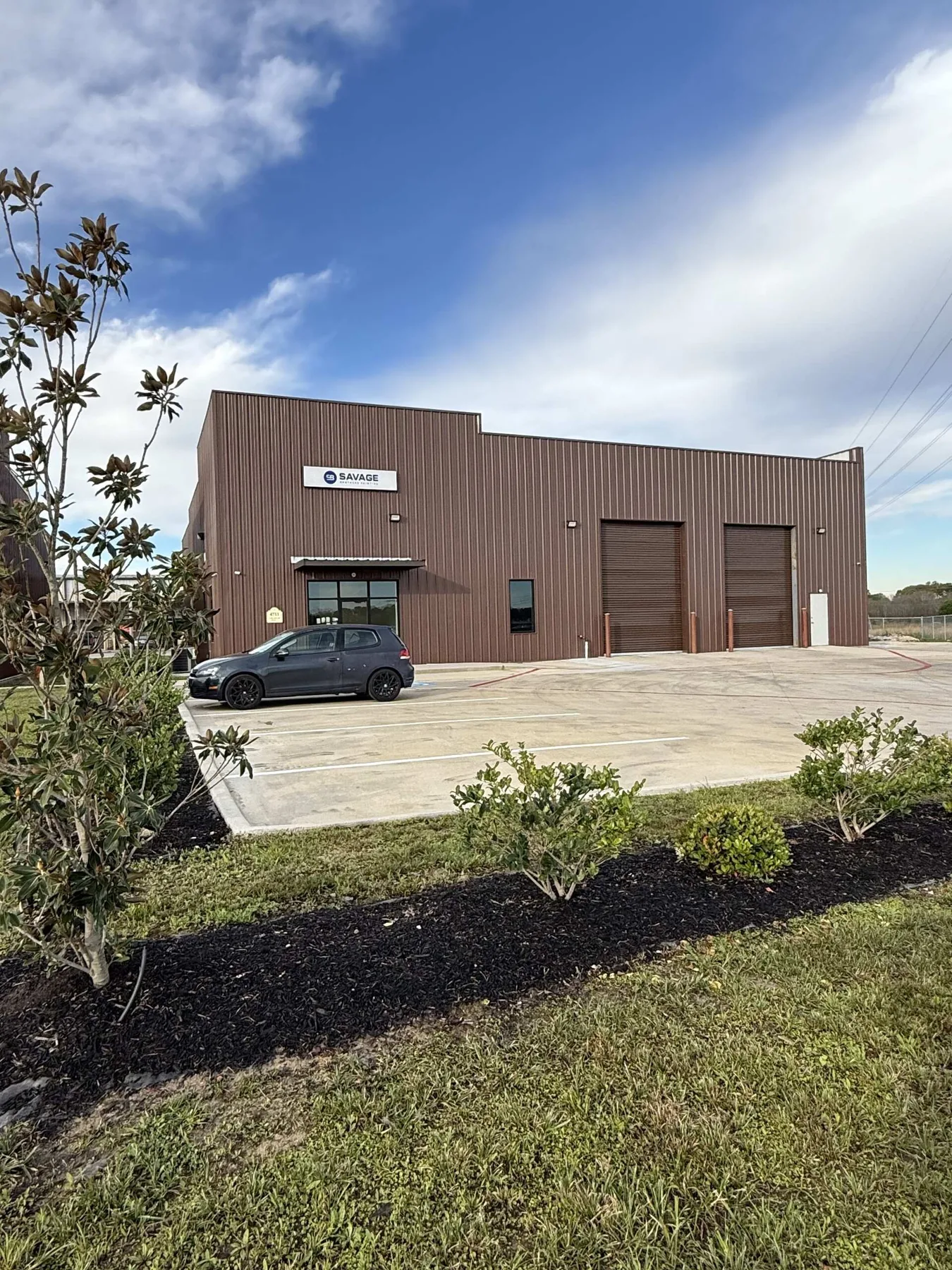 Completed tenant entrance and roll-up bay at 1960 Industrial District