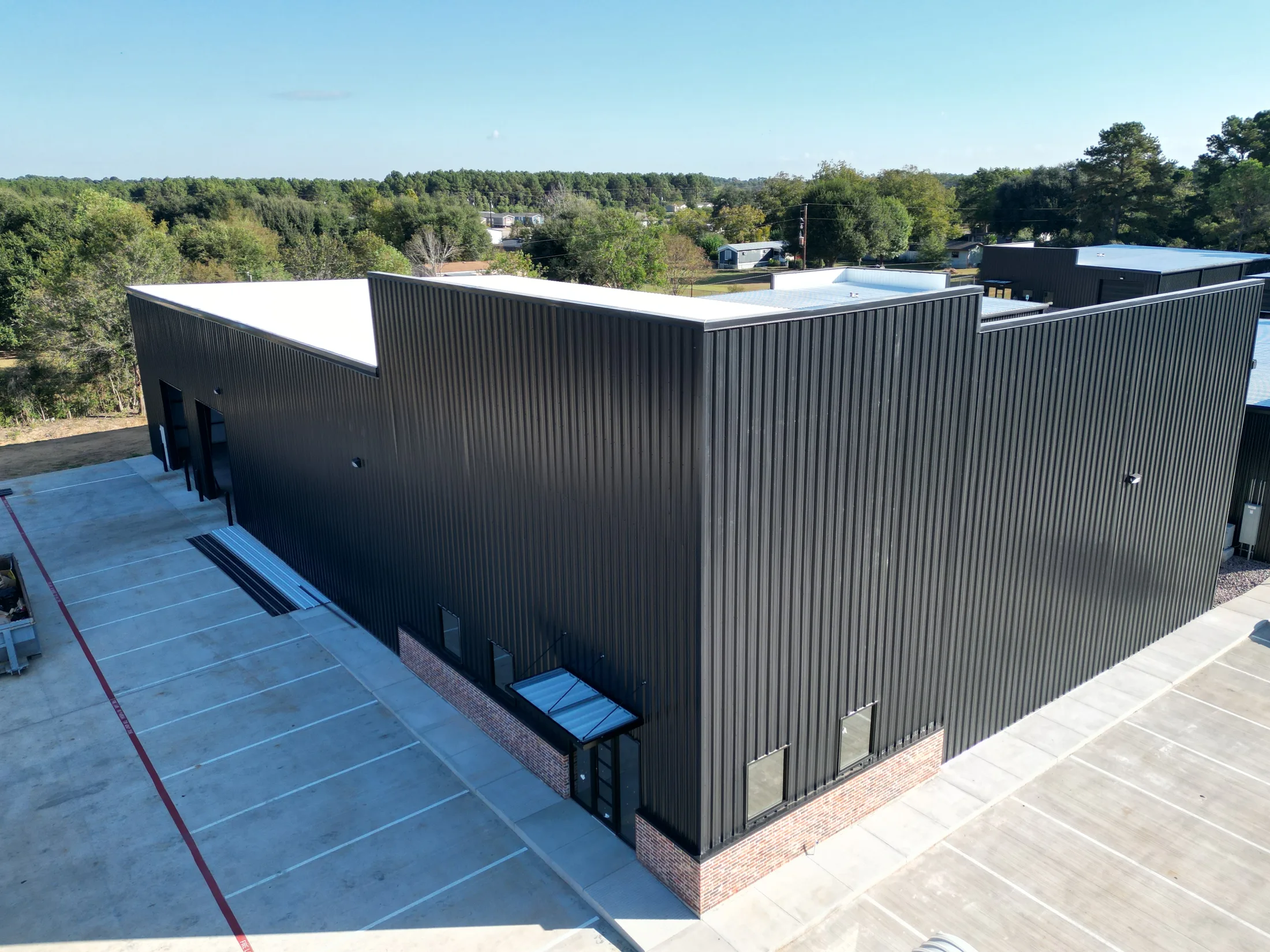 Dark metal industrial building at Telge Phase 1B